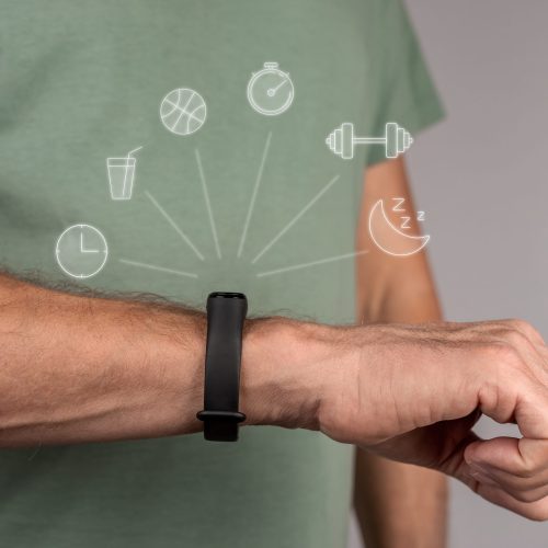 Fitness bracelet on hand, wrist of man closeup. Activity, sleep, gym workout, measure and control concept Fitness bracelet on hand, wrist of man closeup. Activity, sleep, gym workout, measure and control concept. High quality photo